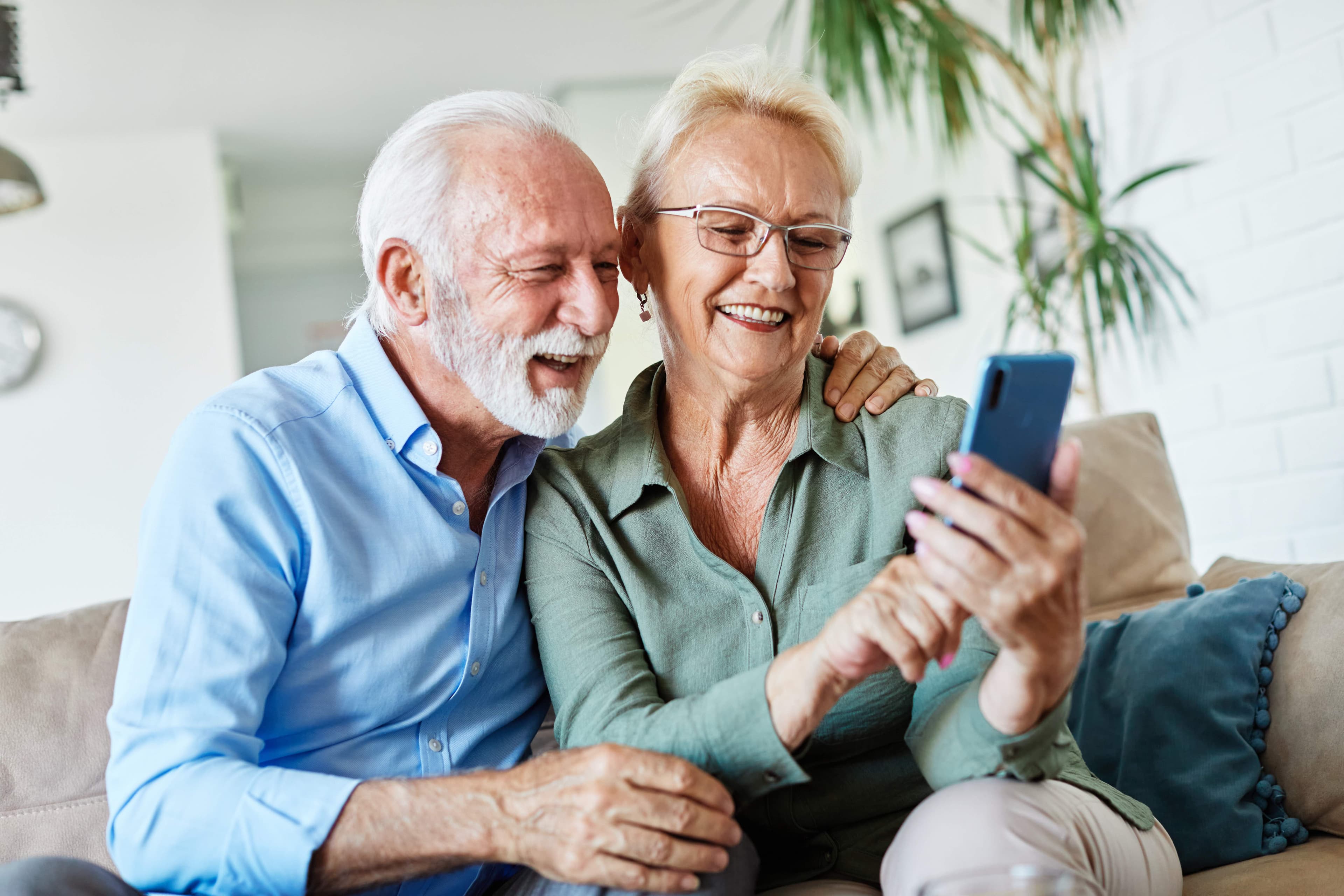 Two long-standing customers looking at their account together